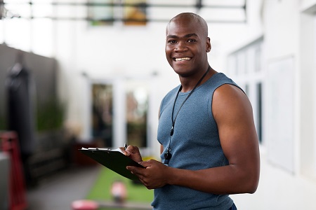 personal
				trainer wth a clipboard