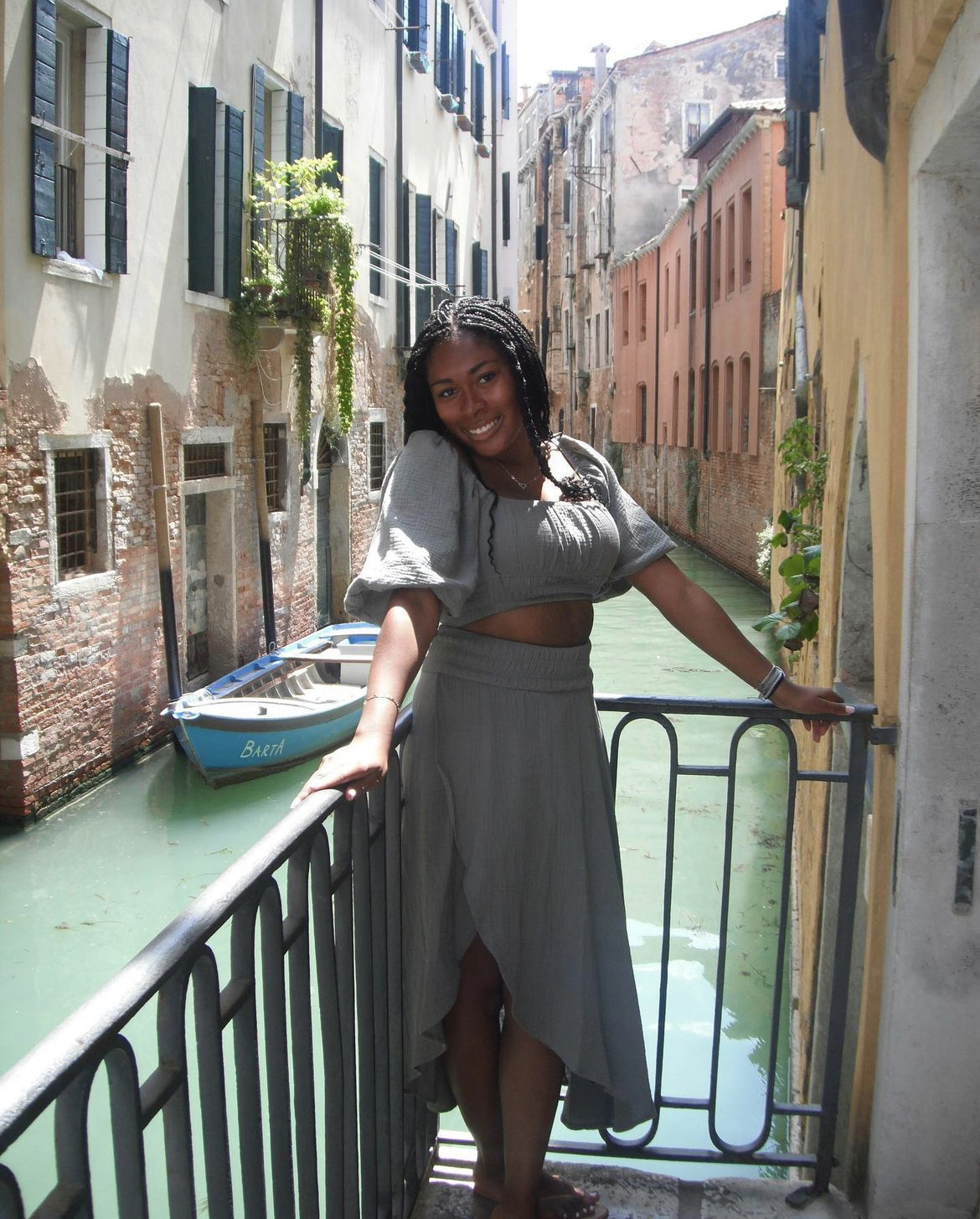 Camille standing in front of a canal in Venice, Italy