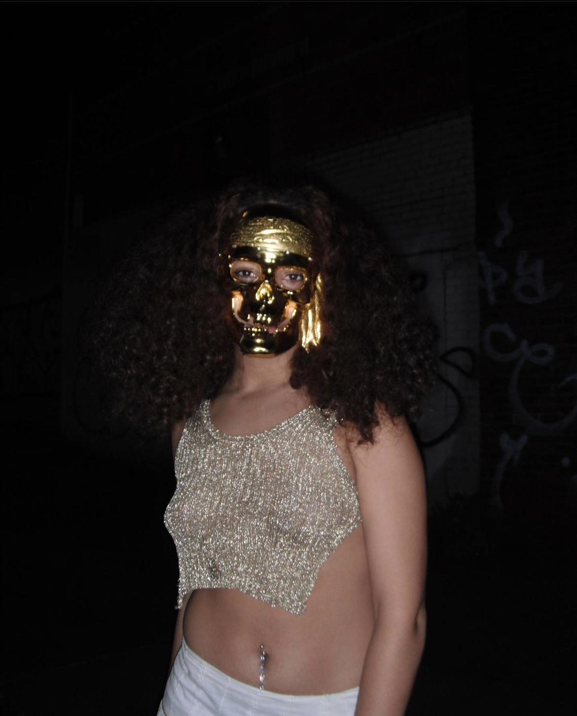 Girl in gold mask