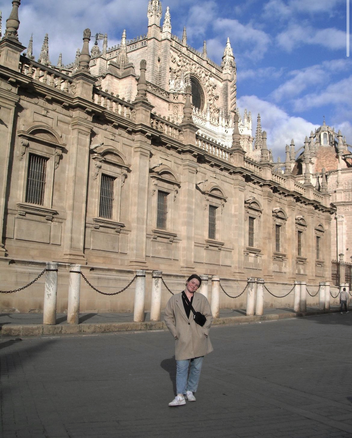 Emily standing in front of a cathedral in Sevilla, Espana